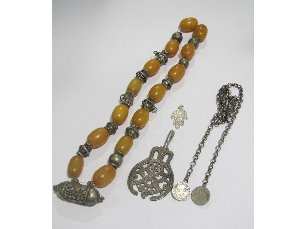 Appraisal: Three white metal Middle Eastern necklaces one with amber spacers