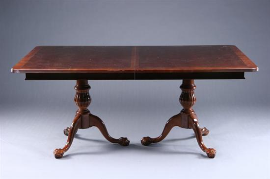 Appraisal: GEORGIAN STYLE DOUBLE-PEDESTAL DINING TABLE th century mahogany Rounded-corner rectangular