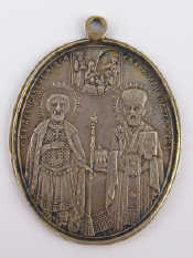 Appraisal: A Russian silver oval icon St Nicholas and Alexander Nevsky