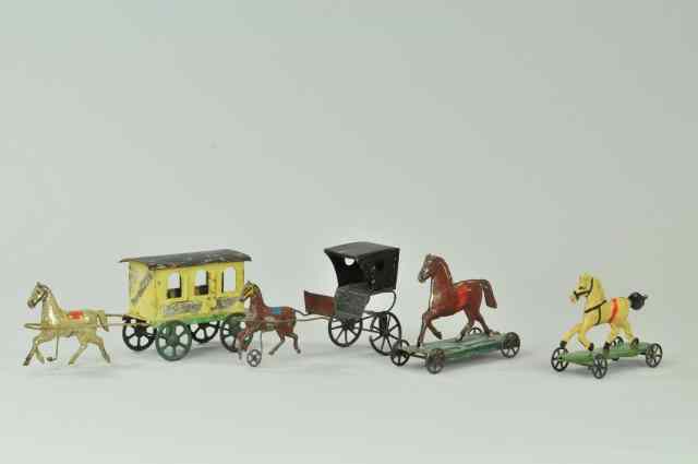 Appraisal: GROUPING OF EARLY AMERICAN TIN TOYS Hand-painted lot includes two