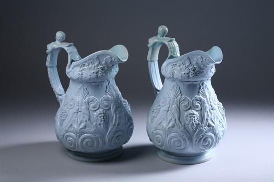 Appraisal: PAIR ENGLISH BLUE GLAZED CERAMIC PITCHERS Molded masque head and