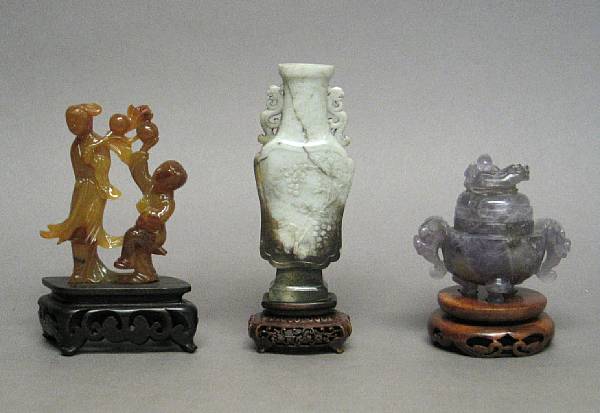 Appraisal: Three hardstone carvings Including one soapstone vase flanked by two