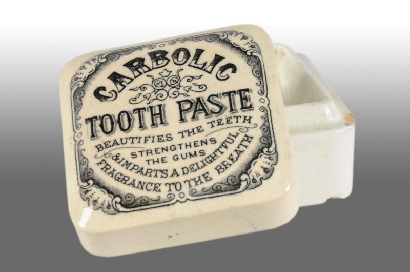 Appraisal: Square Carbolc Tooth Paste Pot Lid Description One corner chip