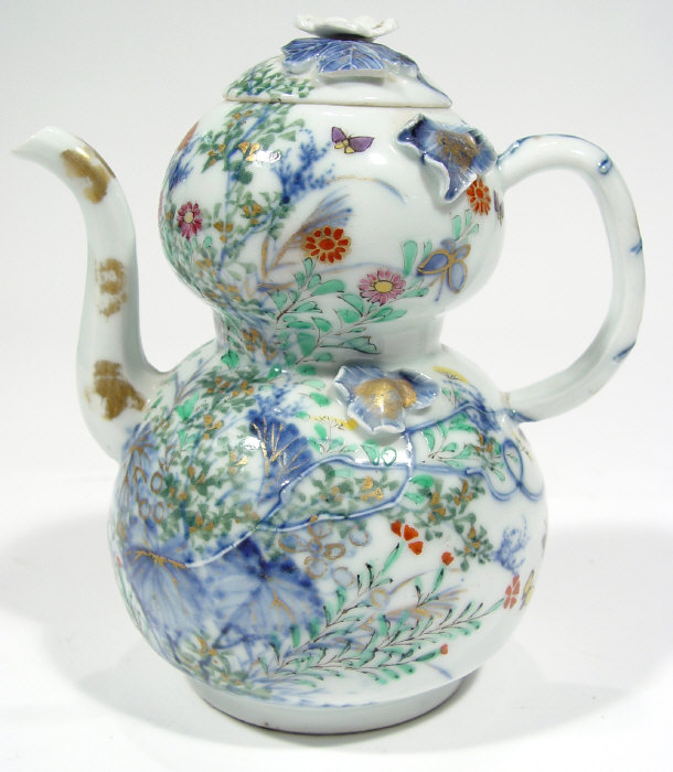 Appraisal: Oriental porcelain double gourd teapot and cover relief moulded with