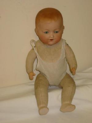 Appraisal: An Armand Marseille bisque head baby doll with blue glass