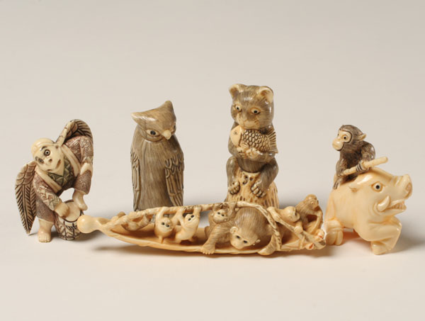 Appraisal: Japanese carved ivory netsukes domestic and mythical creatures Some ivory