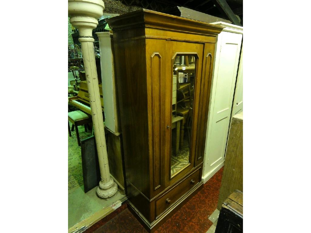 Appraisal: A Victorian mahogany single wardrobe with moulded cornice over a