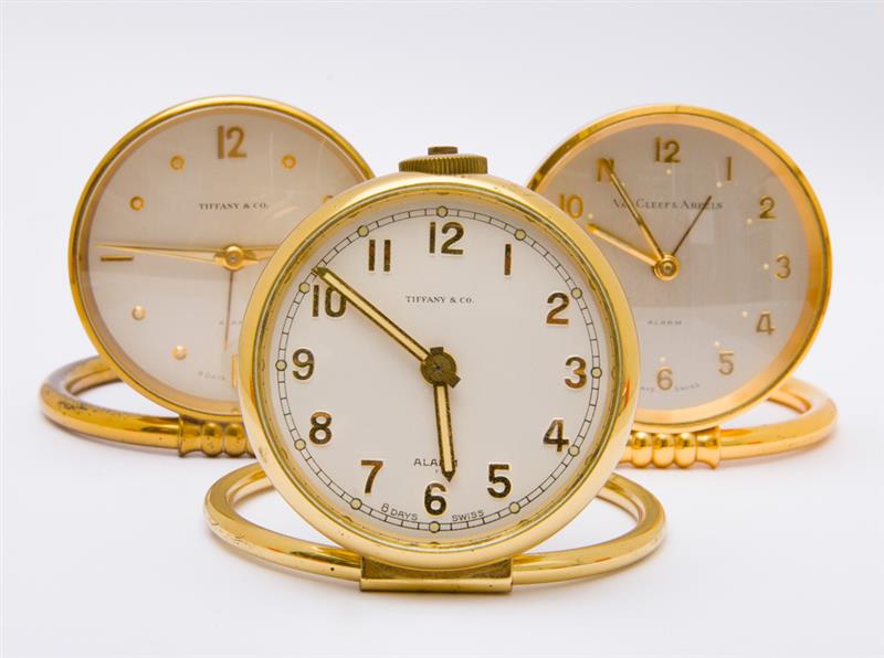 Appraisal: THREE SWISS -DAYS GILT-METAL TRAVEL CLOCKS Two retailed by Tiffany