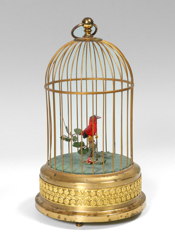 Appraisal: AUTOMATON BIRD IN BRASS CAGE Red bird in brass cage