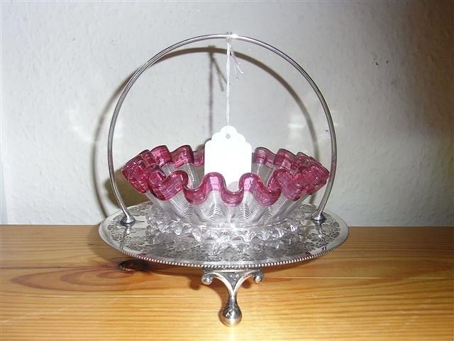 Appraisal: A GLASS AND PLATED BON BON DISH the glass with