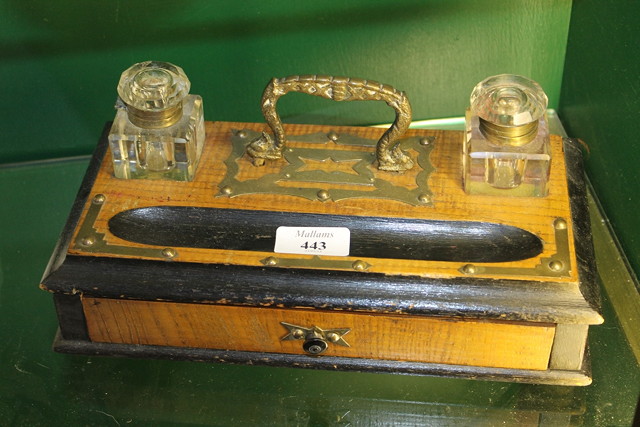 Appraisal: A VICTORIAN DESK STAND fitted with two inkwells with loop