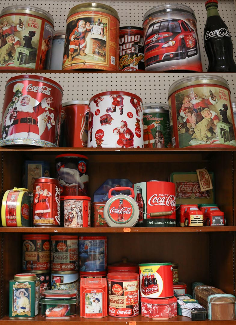 Appraisal: Four shelves of Coca-Cola tins and a resin bottle Undernumber