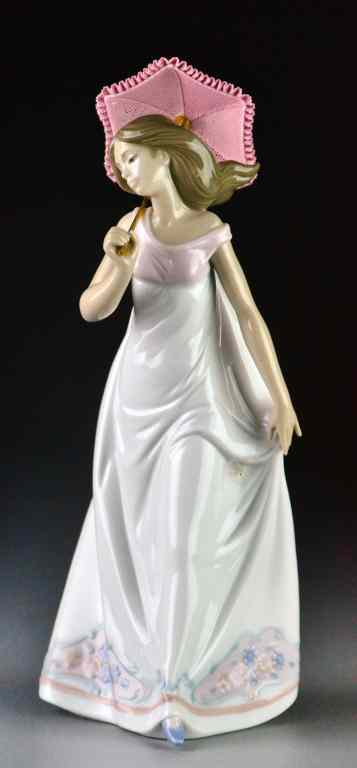 Appraisal: Lladro Porcelain Figurine ''Afternoon Promenade''''Bajo El Sol de Promavera'' depicting