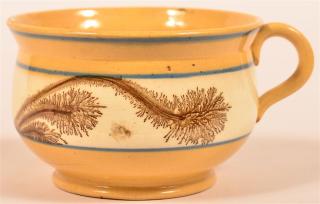 Appraisal: Yellowware Mocha Seaweed Porridge Cup Yellowware Brown Mocha Seaweed Decorated