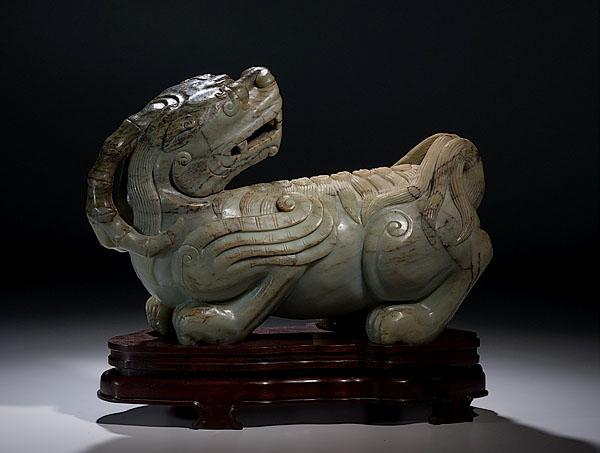 Appraisal: MONUMENTAL CHINESE CARVED JADITE BEAST th century depicting a large