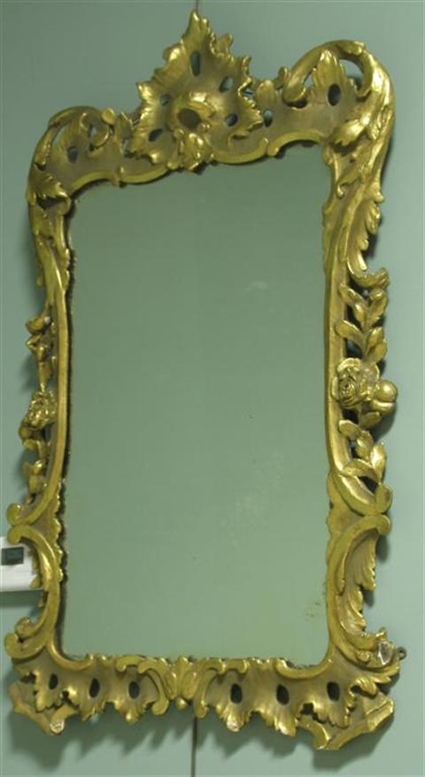 Appraisal: GEORGE II CARVED GILTWOOD MIRROR th century the foliate carved