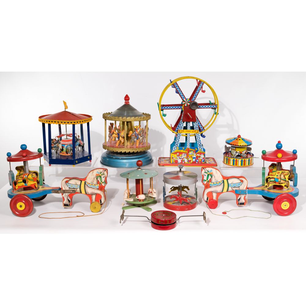 Appraisal: FERRIS WHEEL AND CAROUSEL ASSORTMENT tin wood and cast metal