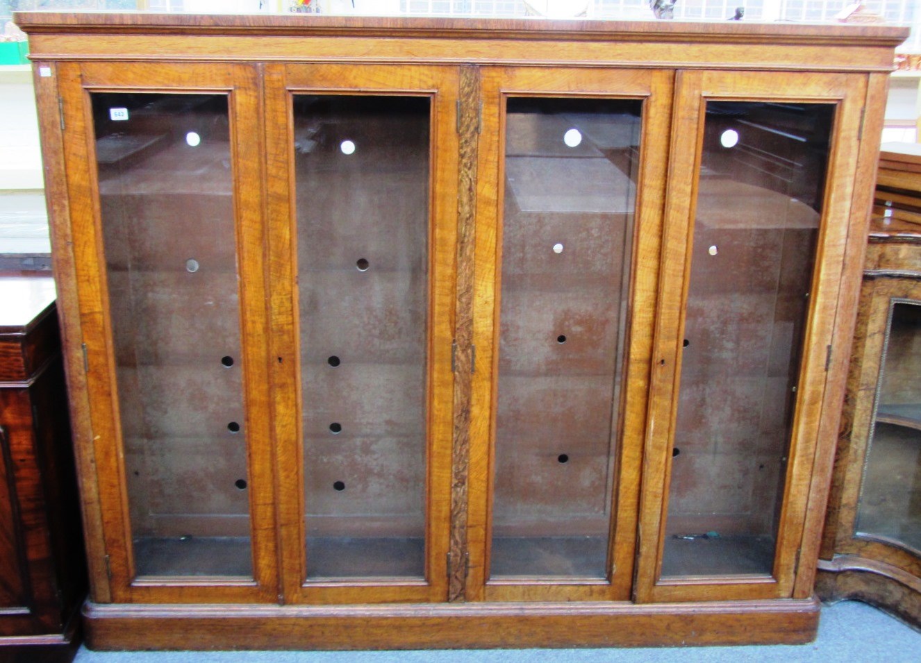 Appraisal: A Victorian oak floor standing glazed four door bookcase on