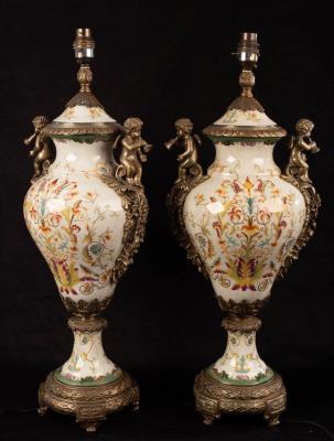 Appraisal: A pair of vase-shaped pottery lamps with gilt metal mounts