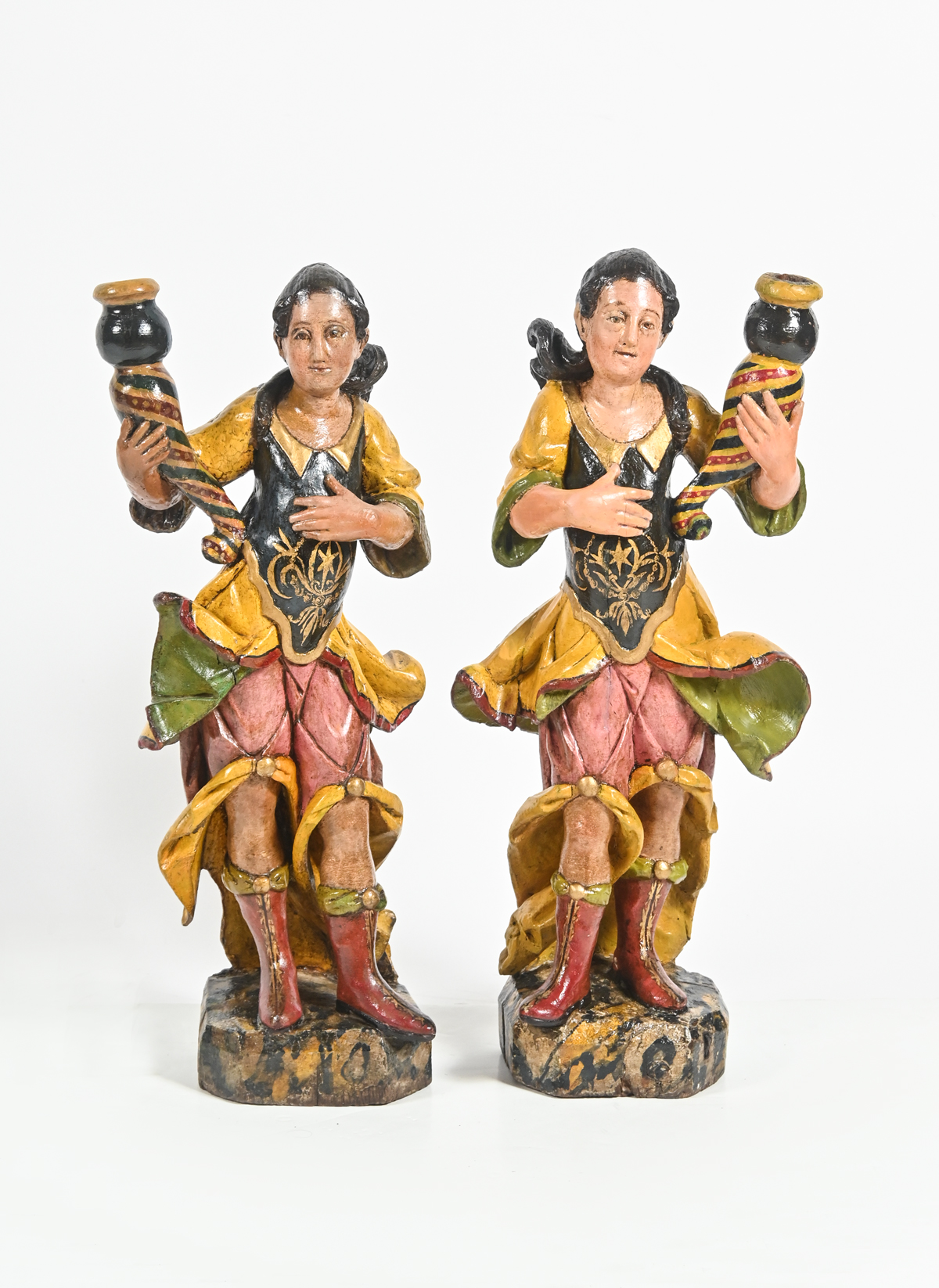 Appraisal: PAIR OF CARVED AND PAINTED FIGURAL CANDLE STICKS Female figures