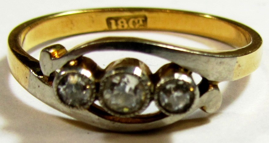 Appraisal: A gold and diamond set three stone ring mounted with