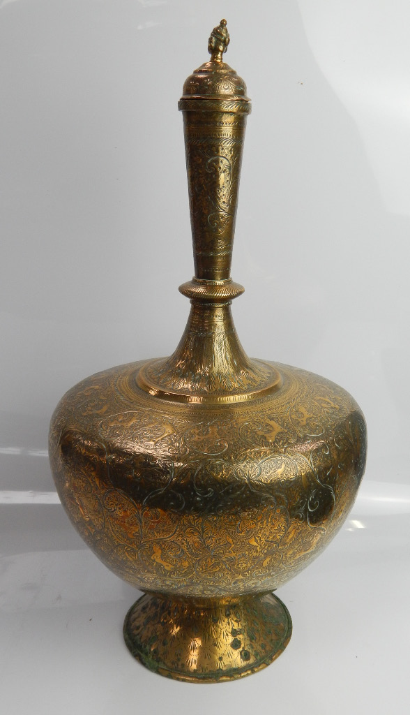 Appraisal: An early thC Indian brass bottle vase and cover profusely