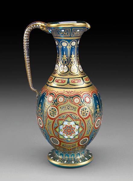 Appraisal: A Lobmeyr style Persian inspired enameled blue tinted glass ewer