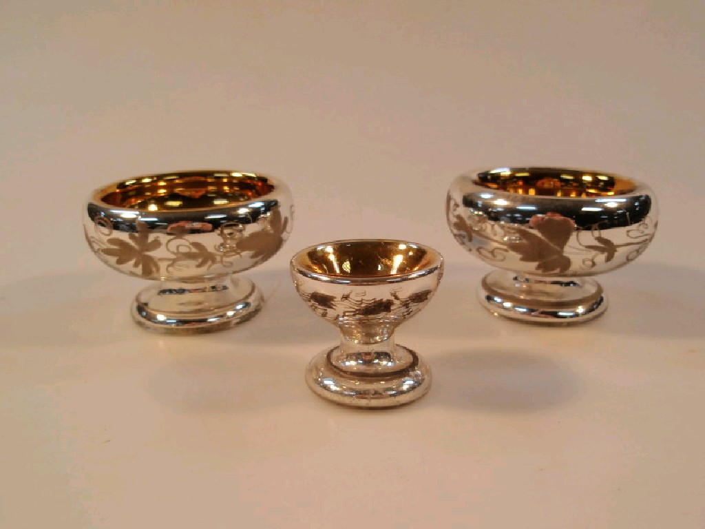 Appraisal: A pair of mercury glass silvered salts the circular bowls