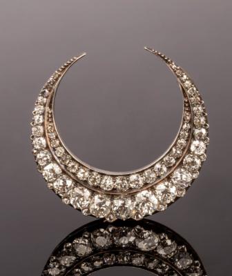 Appraisal: A Victorian diamond crescent brooch set with two rows of