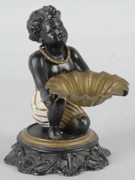 Appraisal: Figural Kneeling Moor Ashtray Description s Nice figure of a