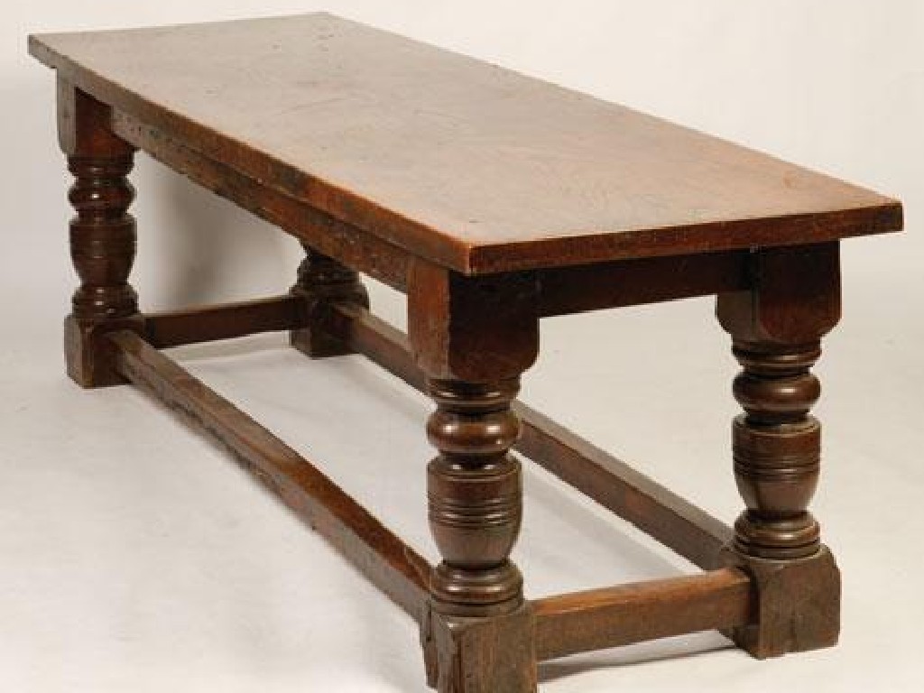 Appraisal: A CHARLES II STYLE OAK AND ELM TABLE the single