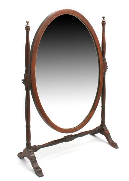 Appraisal: An oval wood framed mirror on stand height in width