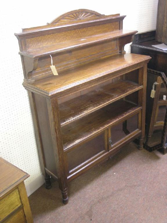 Appraisal: A late Victorian solid oak bookcase raised back with overshelf