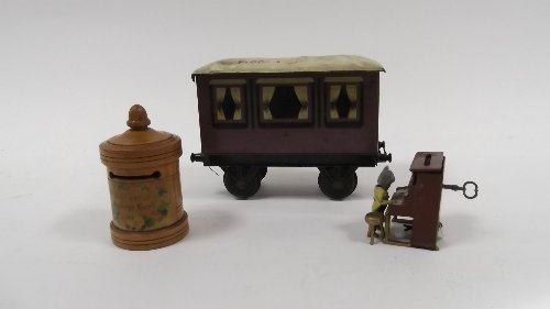 Appraisal: A tinplate moneybox in the form of a piano being