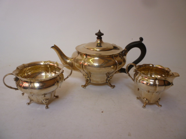 Appraisal: AN EDWARDIAN THREE PIECE TEA SERVICE maker Charles Edwards London