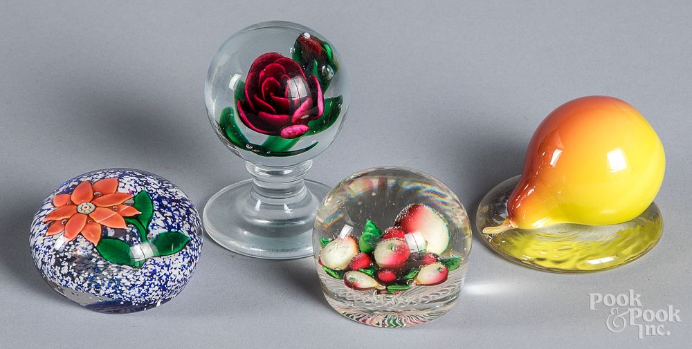 Appraisal: Four glass paperweights Four glass paperweights to include sandwich glass