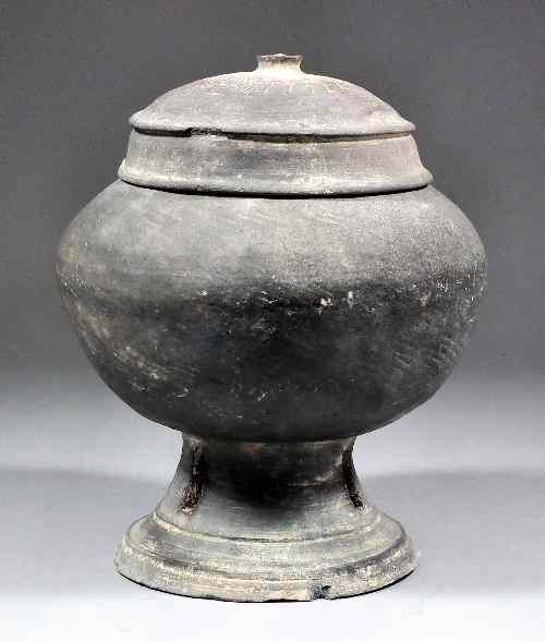 Appraisal: A Korean stoneware funerary jar and cover the lid and