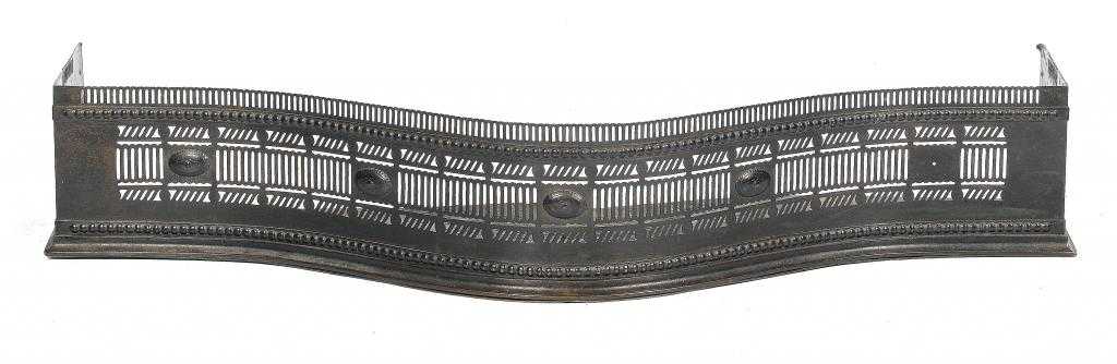 Appraisal: A GEORGE III PIERCED STEEL SERPENTINE FENDER with applied oval