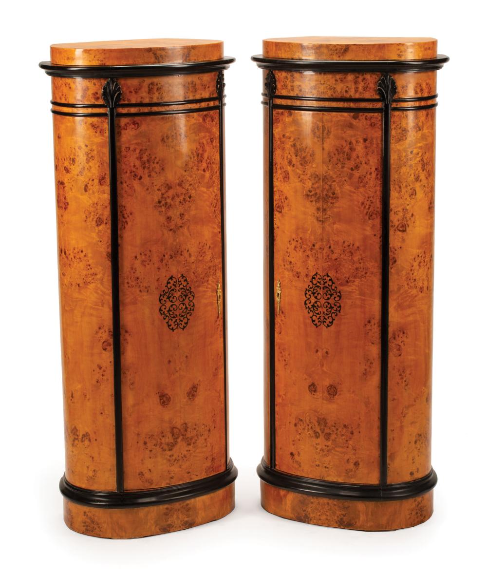 Appraisal: Pair of Charles X-Style Parcel Ebonized Burlwood Pedestal Cabinets oval