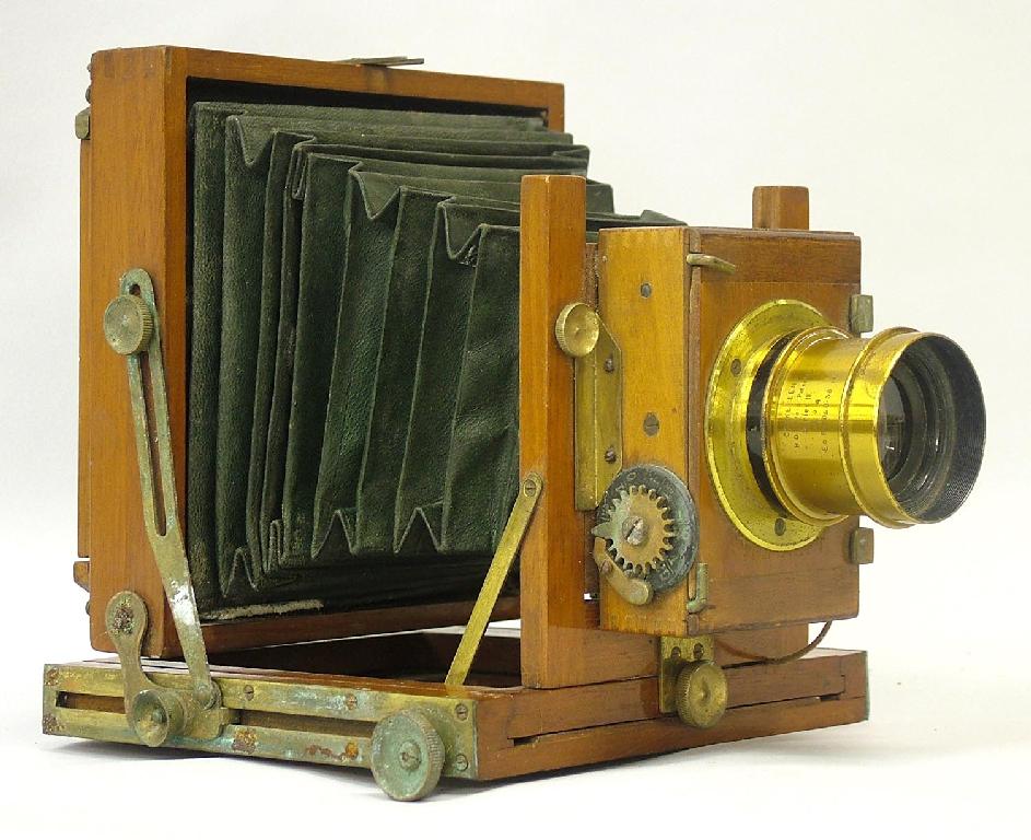 Appraisal: Taylor Taylor Hobson quarter plate mahogany and brass folding camera