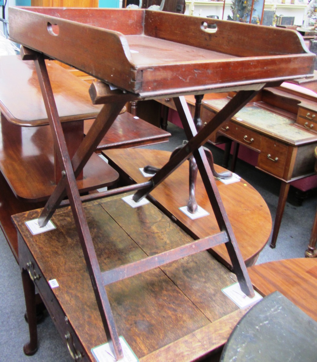 Appraisal: A George III mahogany butlers tray with pierced handles on