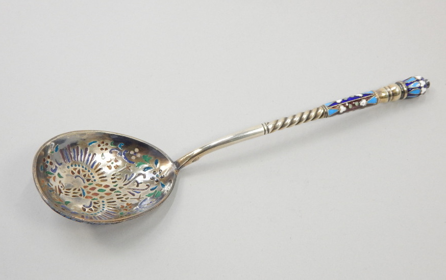 Appraisal: A Russian white metal champleve enamel spoon the reverse of