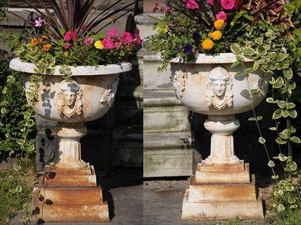 Appraisal: PAIR OF VICTORIAN-STYLE PAINTED CAST-IRON GARDEN URNS Each with hemispherical