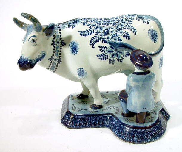 Appraisal: Delft pottery cow the body hand painted with flowers painted