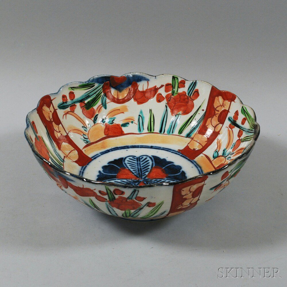 Appraisal: Japanese Imari Fluted Bowl hand-painted with floral motifs in red