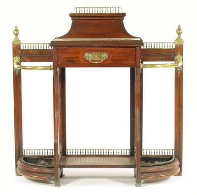 Appraisal: A late Victorian walnut and brass mounted hall stand attributed