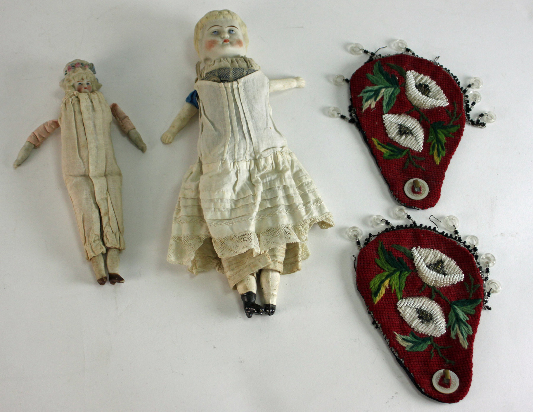 Appraisal: Two small Continental dolls with bisque heads arms and legs