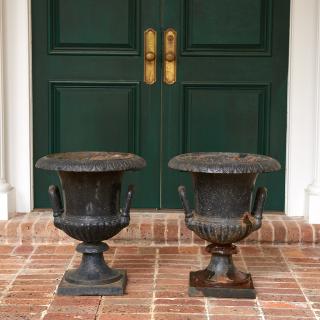 Appraisal: Pair old black painted cast iron garden urns Pair old