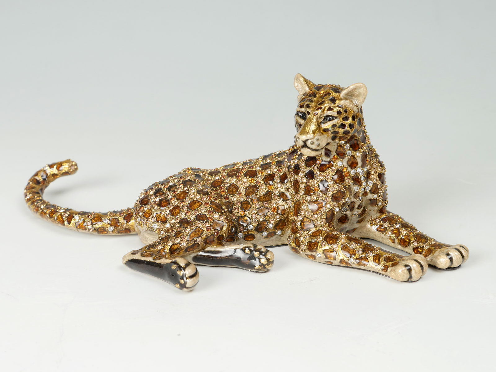 Appraisal: JAY STRONGWATER ENAMEL CRYSTAL RECLINING CHEETAH Reclining cheetah from the