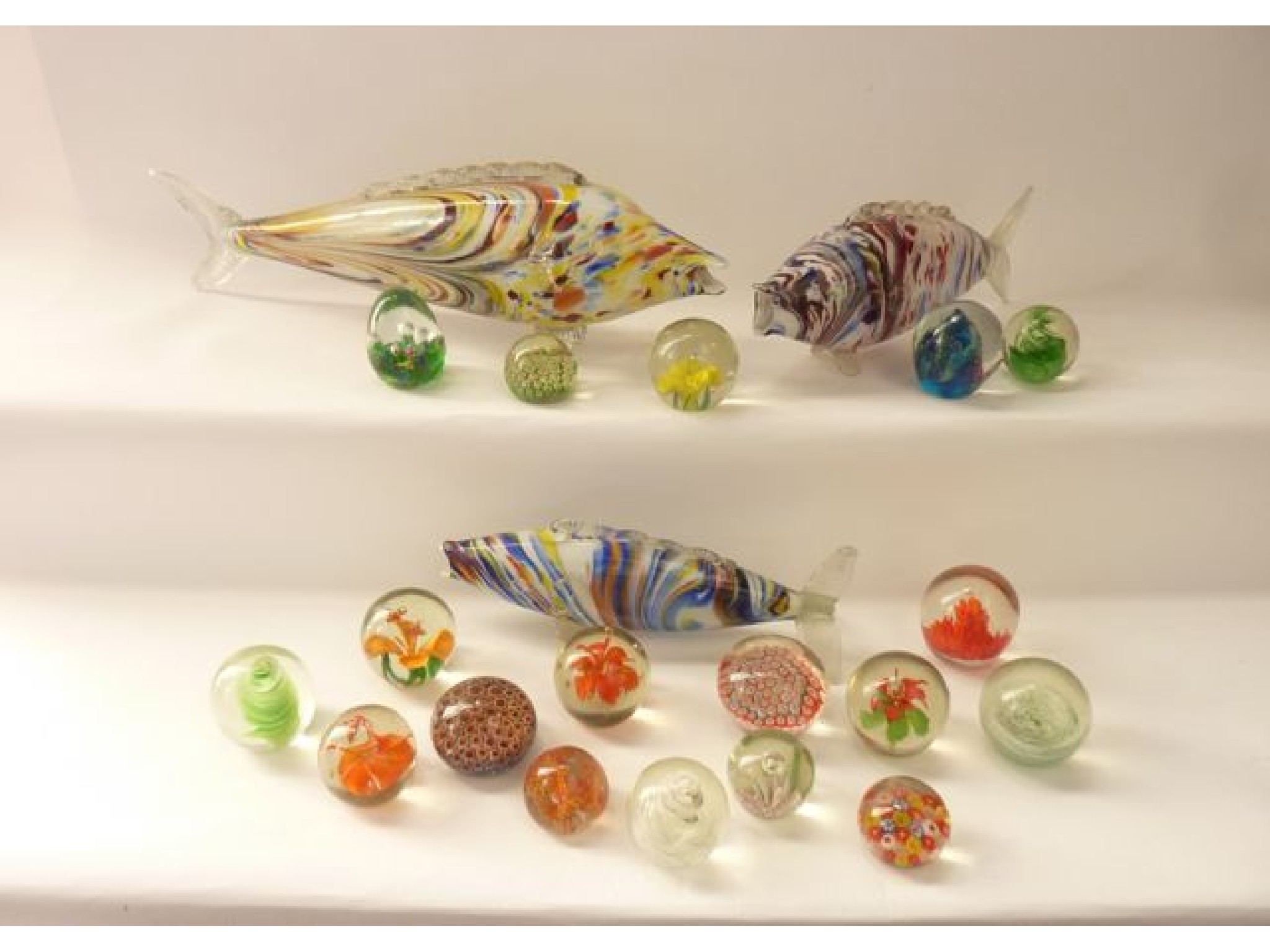 Appraisal: Three Murano glass models of fish all with chaotic mottled